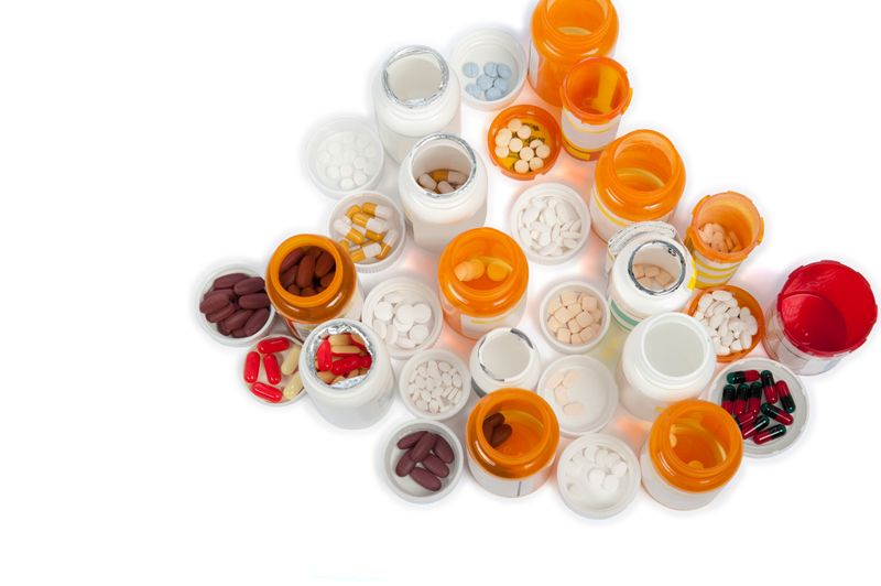 A pharmacist uses a mortar and pestle to compound medication Medication Adherence