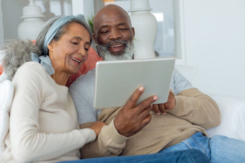 A Pharmacist speaks to their patient about medicare open enrollment Medicare Open Enrollment